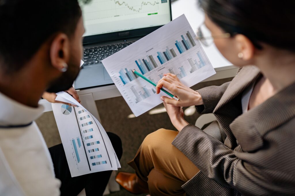 Accountant reviewing financial reports with a business owner